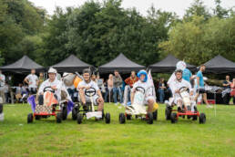 Group of people racing as part of the Soap Box Derby London